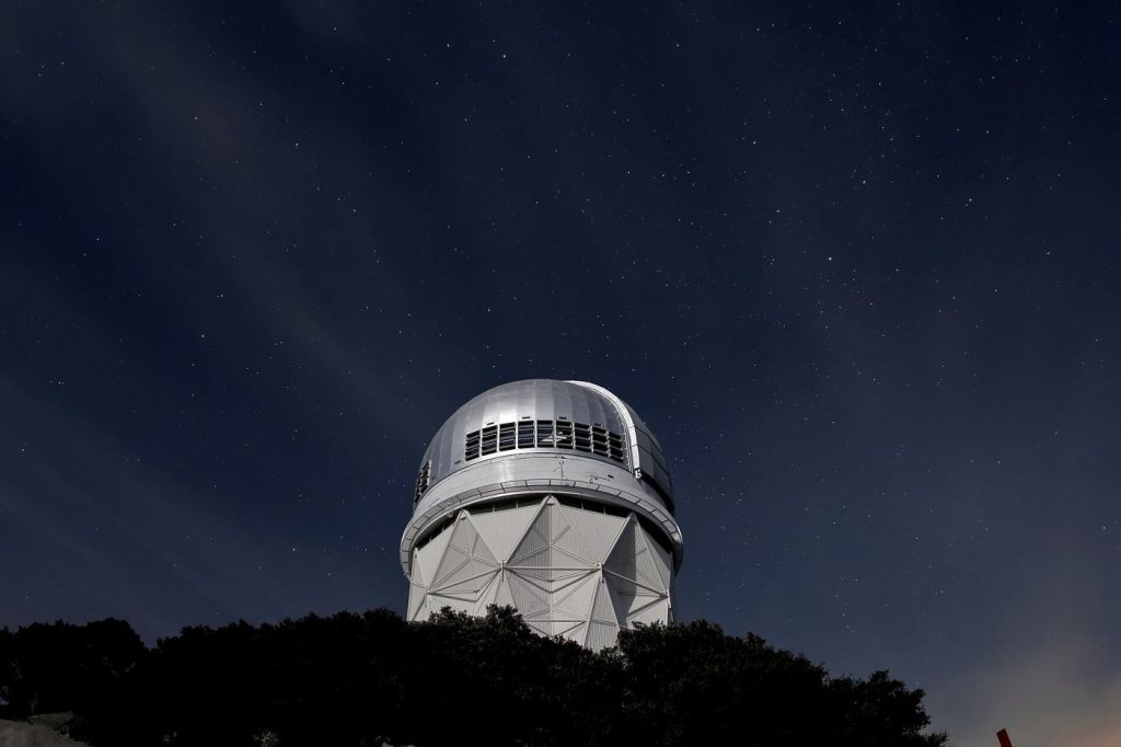 Telescope Study Reveals Cloud Patterns on Distant Exoplanet telescope pointed at a star-filled night sky