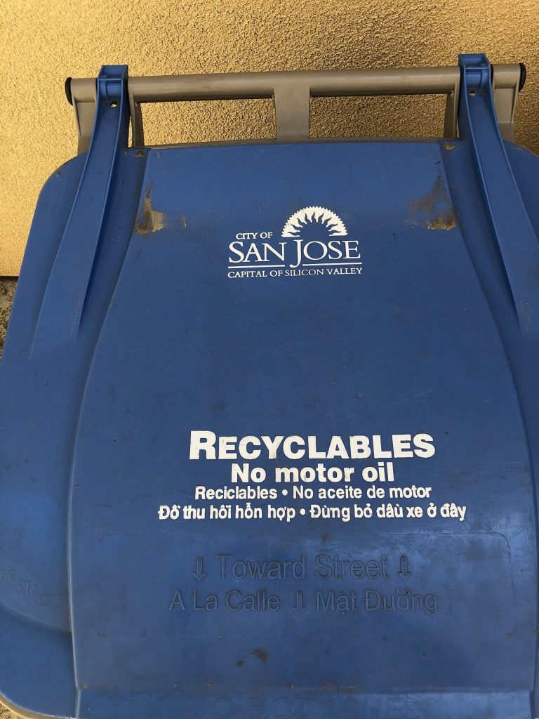 recycling bins lined up on a residential street